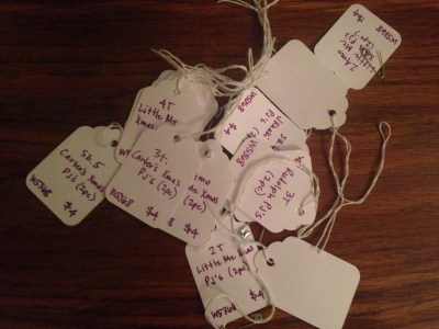 Handwritten consignment sale tags.